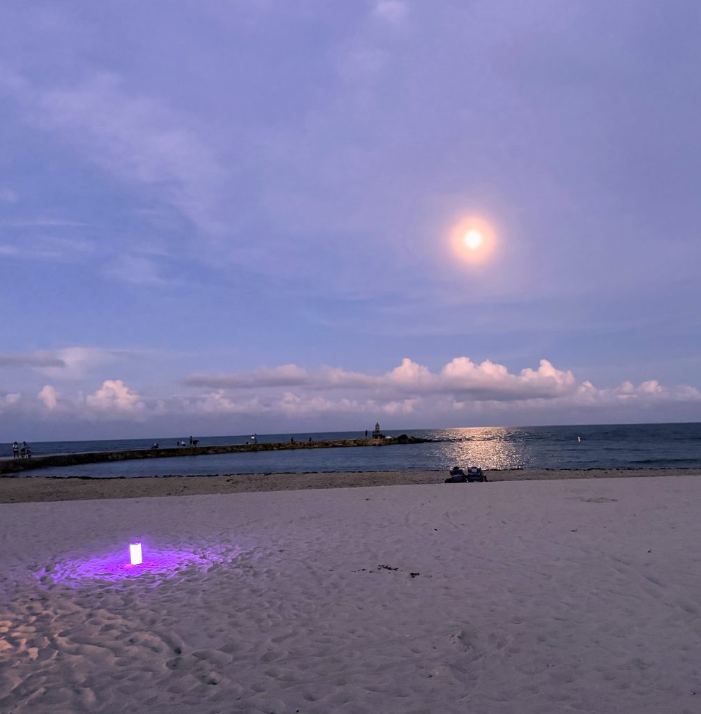 Sunset on beach with candles